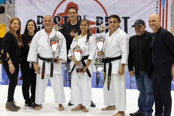 martial arts trophy and athletes holding their awards